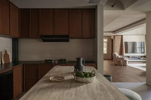 Modern residential kitchen featuring wooden cabinets and a stone countertop.