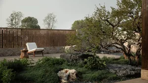 A serene modern garden retreat featuring stone planters, wooden patio furniture, and a minimalist design.