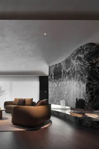 A modern living room featuring luxurious marble elements.