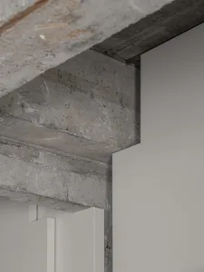 Modern minimalist interior with concrete details and clean lines.