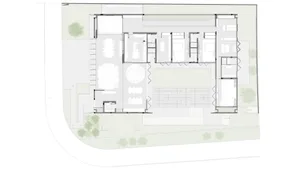 A floor plan of a modern office space with white flooring and minimalist design