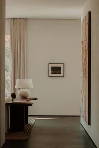 Contemporary lobby featuring concrete flooring and minimalist decor.