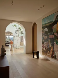 A modern interior space featuring contemporary art and mixed materials.