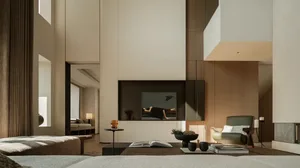 A minimalist living room with modern furnishings, a large window, and a neutral color palette.