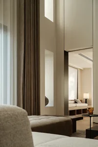 Modern minimalist living room with fabric seating and wooden accents.