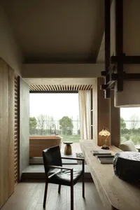 A modern residential interior featuring minimalist design, wood materials, and a serene atmosphere.