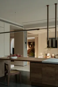 A modern residential space featuring wooden furniture and a clean, minimalist design.