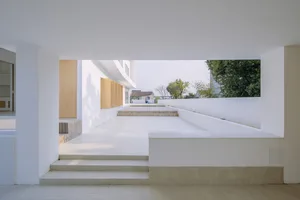 Modern architecture with white concrete walls and a minimalist design.