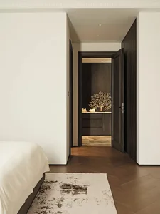 A modern bedroom featuring white walls, a wooden floor, and a wooden wall with a sculptural installation.