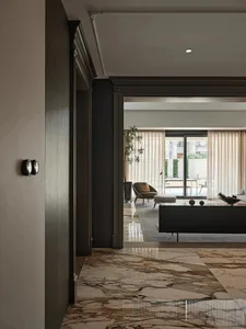 Modern living room featuring marble flooring and minimalist design.