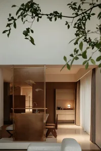 Modern, neutral-toned living room interior with sleek, minimalist furniture and a serene, minimalist atmosphere.