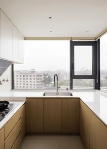A modern, minimalist kitchen featuring wooden cabinets, glass windows, and stainless steel appliances.