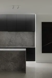 Modern kitchen featuring gray granite countertops and backsplash