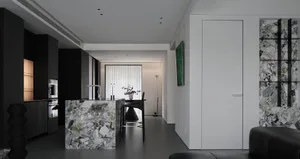 現代極簡廚房，採用大理石飾面與俐落深色櫥櫃。