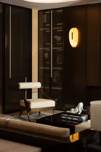 Modern living room featuring glass walls, leather seating, and marble accents