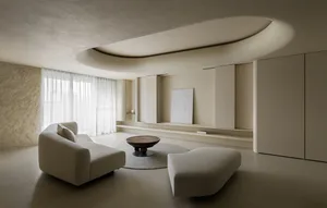 Modern living room with concrete furniture and a minimalist design style.