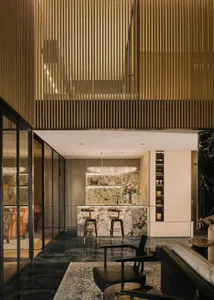Modern industrial commercial lobby featuring wooden paneling and ambient lighting