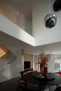 Modern interior design featuring metallic accents, glass elements, and wooden finishes.
