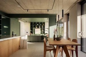 Minimalist modern living, dining, and kitchen space with wooden furniture and a concrete wall.