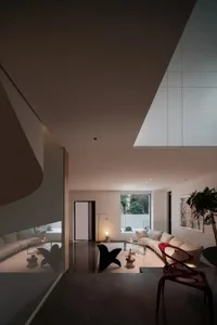Modern minimalist living room featuring concrete furniture and floor.