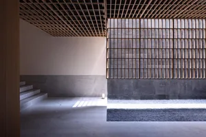 A modern interior design with concrete stairs and large windows