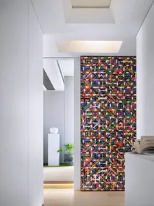 Modern interior space featuring a vibrant, multicolored pattern tile wall, with a white column and potted plant in the backgr