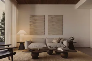 A modern living room with neutral-toned decor and minimalist design elements.