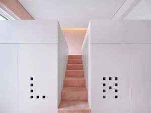 Modern minimalist staircase with concrete steps and white walls