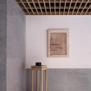 A minimalist interior featuring concrete flooring.