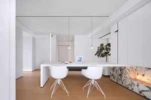 A modern office space featuring white marble materials.