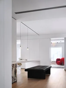 Modern living room interior featuring wood and marble materials.