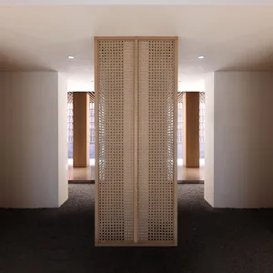 Modern interior design featuring a woven panel wall with a minimalist aesthetic