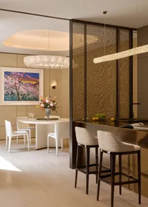 A modern kitchen featuring a transparent glass bar.