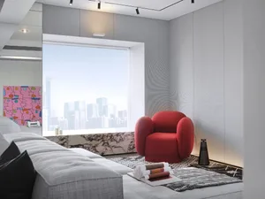 Modern living room featuring a red accent armchair, grey couch, and cityscape view through the window.