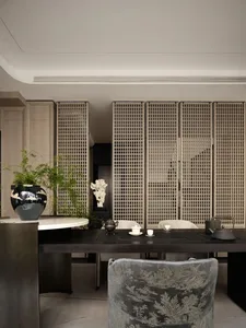 Modern living room featuring a wooden table and wall panels.
