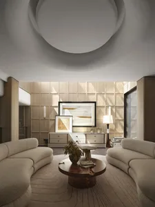 A modern interior living room with curved sofas, a round wooden coffee table, and a minimalist art gallery wall.