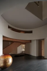 Modern residential interior featuring a sleek, open-concept staircase with timber elements.