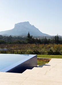 Concrete pool overlooking mountain and landscape