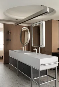 Modern bathroom vanity with concrete countertop and industrial design elements.