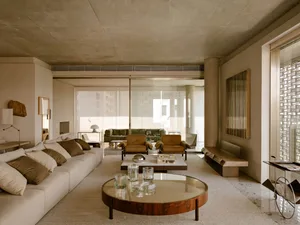 A modern living room featuring concrete materials and minimalist design.