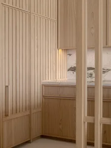 Modern minimalist interior featuring wooden materials and clean lines.