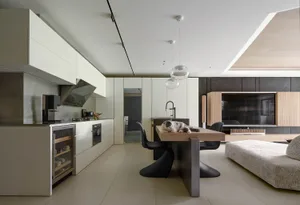 A modern residential kitchen featuring concrete and wood elements.