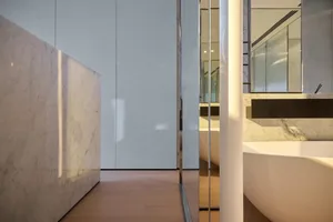 A modern bathroom featuring marble finishes.