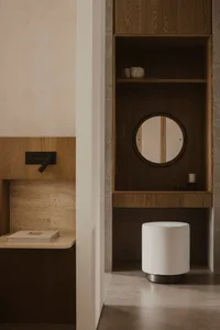 A modern bathroom with wooden features and minimalist design