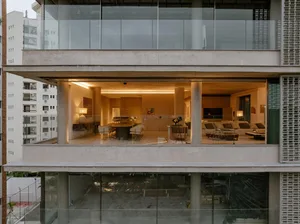 Modern living room with concrete walls and furniture.