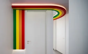 White door with a colorful painted edge on a wall