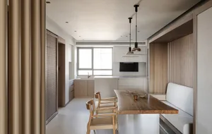 Modern minimalist kitchen with natural wood accents and white cabinetry