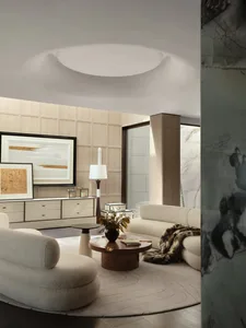 A modern living room with neutral tones and minimalist design elements.