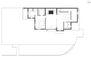 Floor plan of a modern residential layout with open spaces and minimalist design.