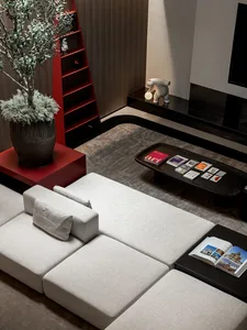 Contemporary living room with fabric sofa, concrete floor, and metal elements